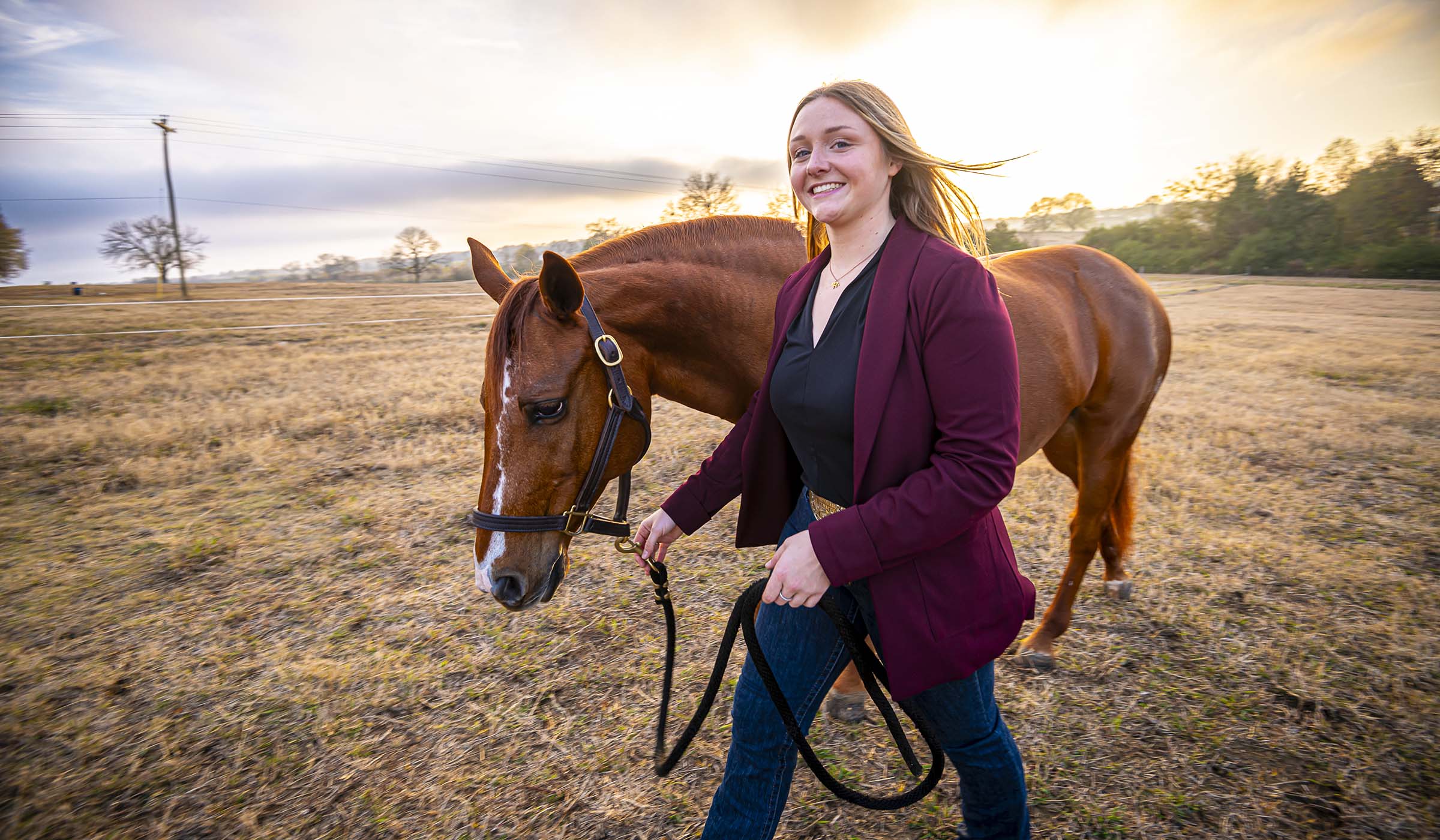 Kasey Losik, pictured walking with a horse on ֱ&#039;s South Farm